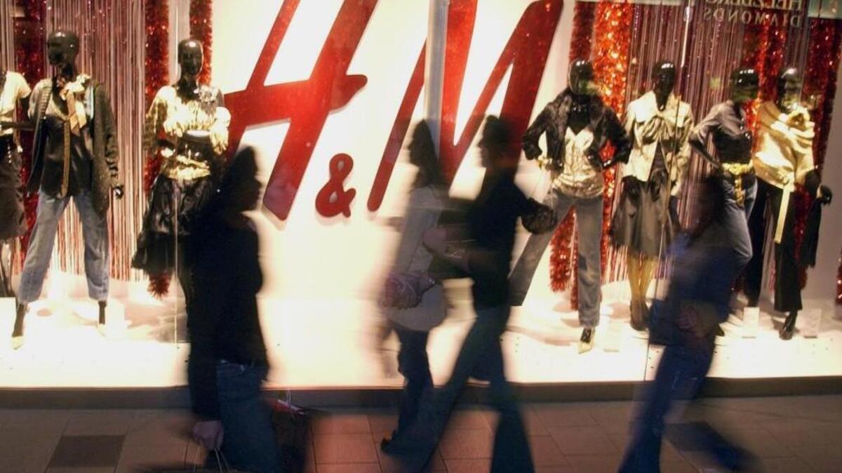 Shoppers walk past an H&M store in the Mall of America in Bloomington, Minnesota. H&M is opening a store next week at Olympia’s Capital Mall.