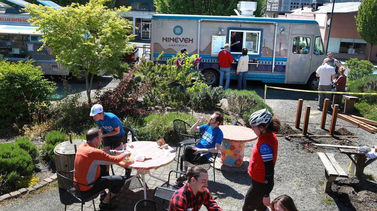 Outdoor diners gather in the courtyard behind the Nineveh Assyrian food truck in downtown Olympia in 2013. Nineveh was one of the restaurants that landed Olympia on online magazine Thrillist.com’s “15 American Cities That Secretly Have Great Food Scenes.”