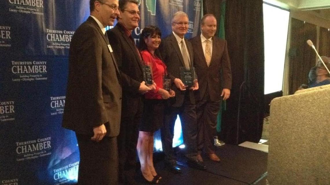 The 2016 Boss of the Year winners (second from left): Capital Mall General Manager Kevin Johnston; RHD Enterprises owner Rozanne Garman; and Port of Olympia Executive Director Ed Galligan.