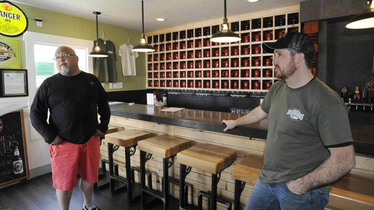 Northwest Beerwerks’ co-owner Ton Johnson (left) and manager Matt Smith are pleased with the steady increase in business at their Pacific Avenue taproom.