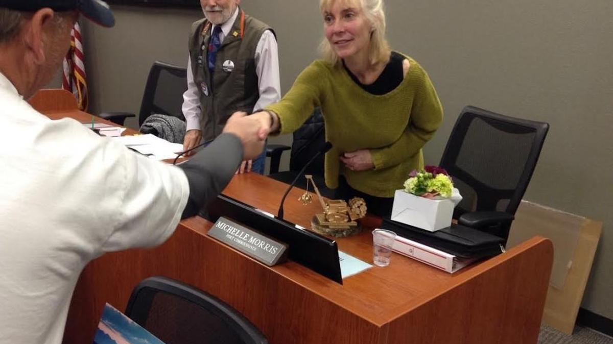 Several in the audience thanked Port of Olympia Commissioner Michelle Morris for her time spent on the commission. In front of her is the “porty award,” which was presented to her by an audience member.