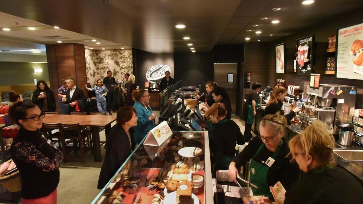A steady line of customers moves through the new Starbucks on the first floor of Providence St. Peter Hospital on Nov. 15.