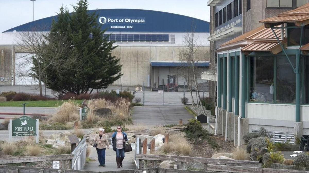 Visitors walk through the Port Plaza on the Olympia waterfront on Wednesday, Feb. 16, 2016. The site - which includes the Rants Group Building and Anthony's Restaurant - was developed by the Port of Olympia on property that the Washington State Department of Natural Resources says it owns.