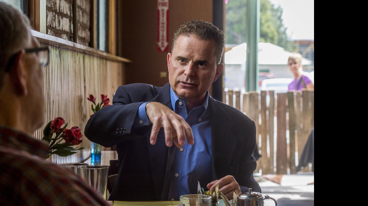 
Karl Newman, president of the Northwest Insurance Council, talks about earthquake insurance in a cafe in Puyallup last week. .
