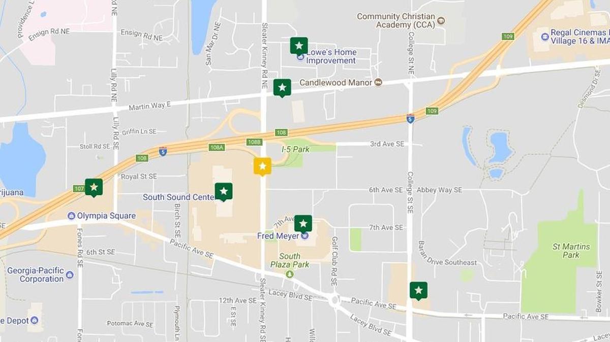 A map shows the various Starbucks locations in the Lacey area. Green icons mark an existing store or stores, while the gold icon marks the location of a proposed store.