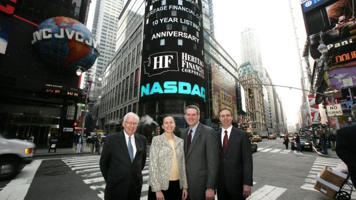 Heritage Financial Corp. President and Chief Executive Brian Vance (center) is shown here during a trip to New York City.