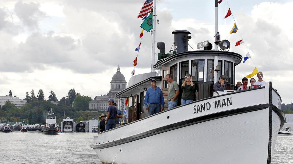 The local historic tug Sand Man heads out to the race course for the 2014 Harbor Days tugboat races on Budd Inlet.