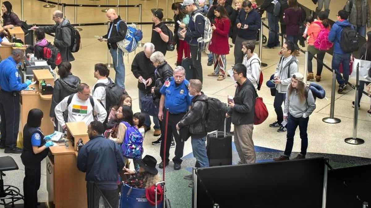 Thanksgiving week travel kicks off smoothly for these travelers who seem to pass through security checks relatively easily Monday at Seattle-Tacoma International Airport.
