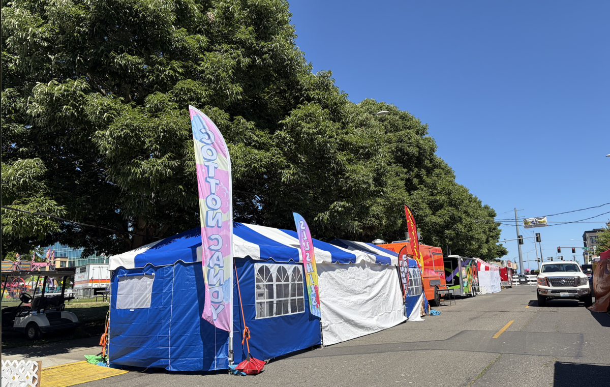 Food vendors prepare for five days of sales during Capital Lakefair, Olympia’s annual summer festival. The 12 booths and trucks will donate all generated profits to charities of choice.