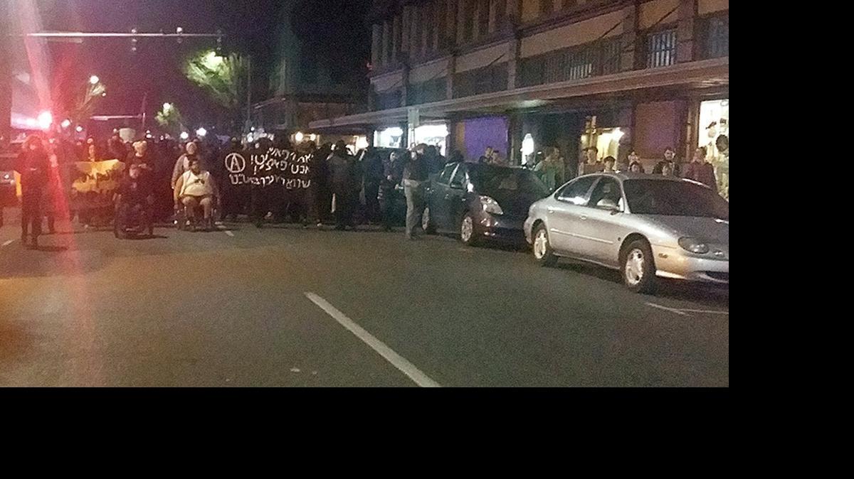 
Protesters march in downtown Olympia on May 30, 2015.
