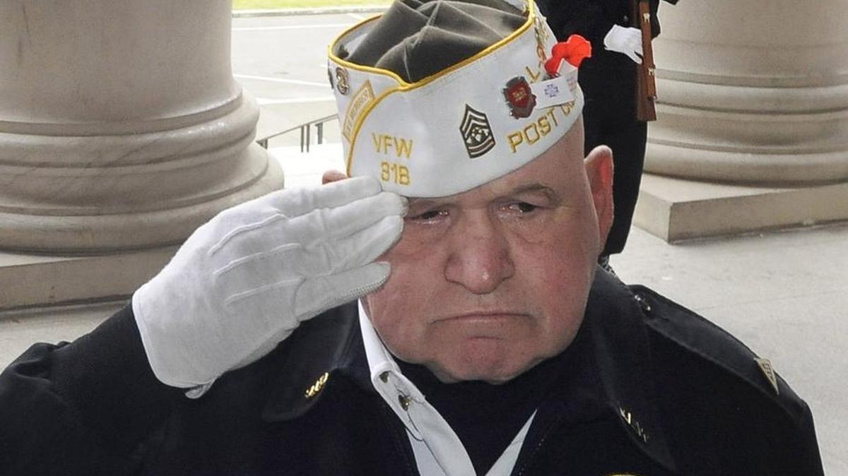 After 25 years as VFW Post 318 Honor Guard commander Ken Wojczynsk salutes for the final time as their leader as he prepares to pass the torch to fellow Honor Guard member Billy Reese, who's seen behind him standing at parade attention at the conclusion of the annual Memorial Day ceremony at the Capitol Rotunda.The annual remembrance ceremony is sponsored by the Thurston County Veterans Council.