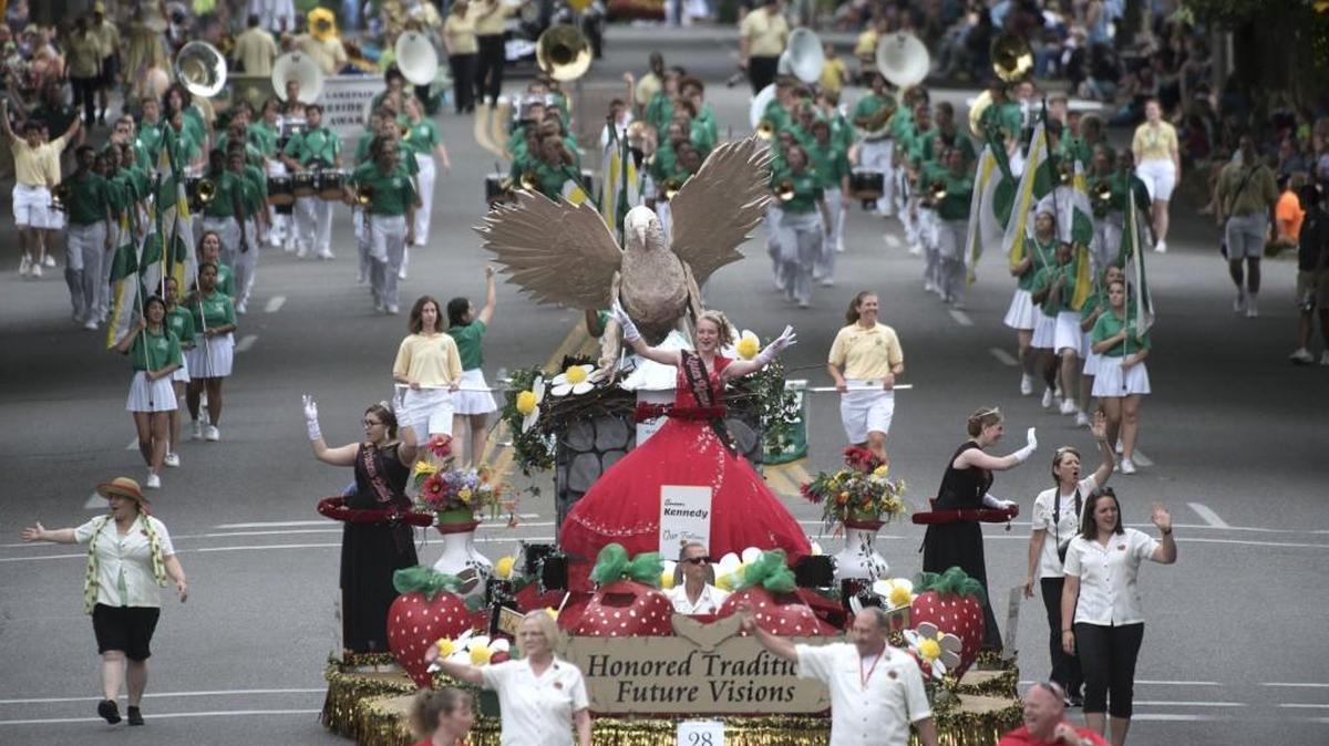 Queen Kennedy Doty ride atop the Marysville Strawberry Festival float as the Capital Lakefair Grand Parade rolls up Capitol Way in Olympia on Saturday, July 16, 2016.
