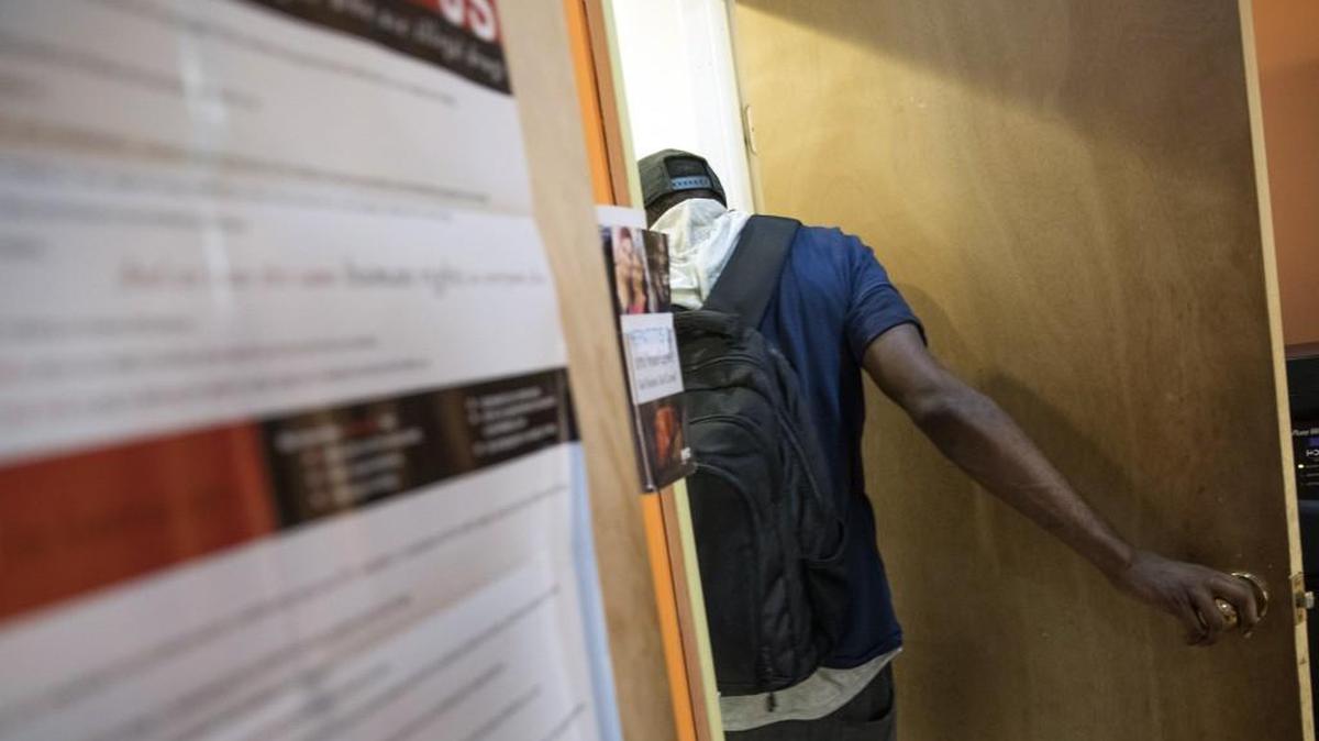 In this Tuesday, July 3, 2018, photo, a member enters the bathroom at VOCAL-NY headquarters in the Brooklyn borough of New York. VOCAL-NY runs a needle exchange and harm reduction services, as well as overdose prevention and other services for people who use drugs. (AP Photo/Mary Altaffer)