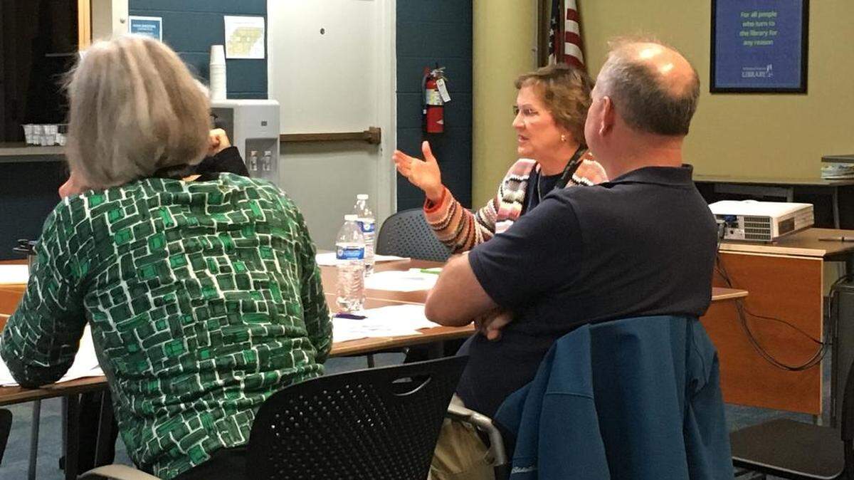 Timberland Regional Library board and facilities committee members Corby Varness (shown addressing the committee), Brian Zylstra and Brenda Hirschi say they will recommend that a proposed capital facilities plan be rejected.