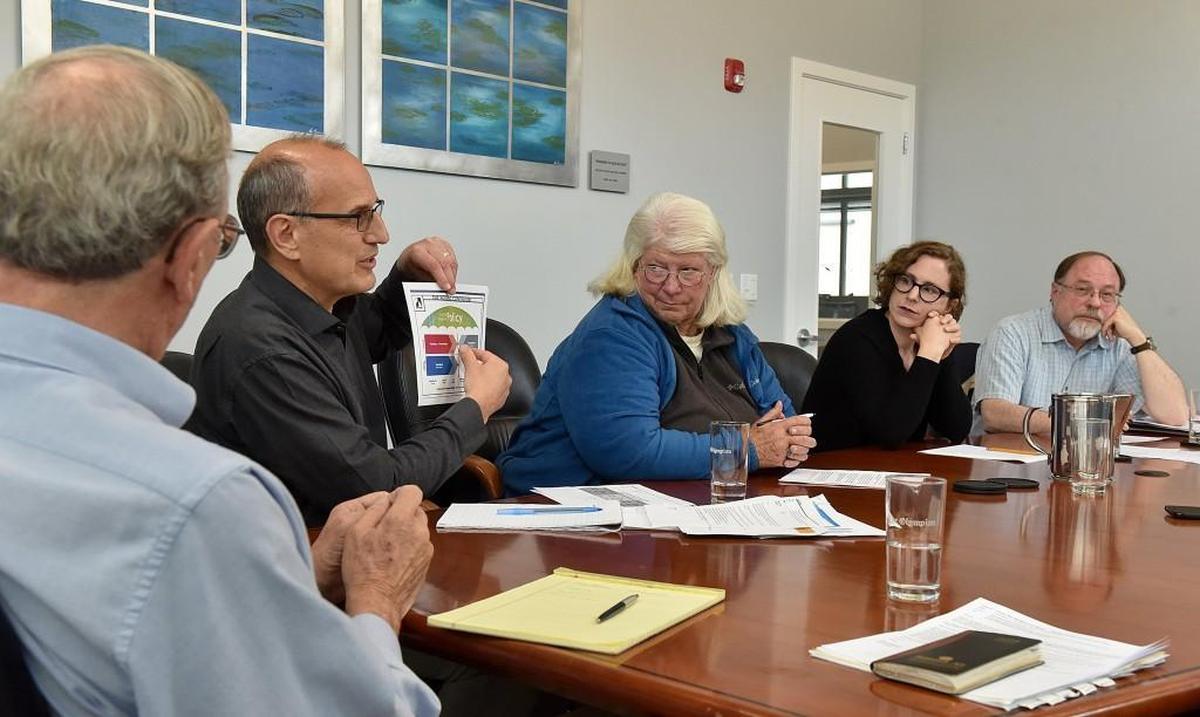 From left: Bob Jacobs, Leonard Bauer, Pat Rasmussen, Janae Huber and Jim Keogh at a meeting with The Olympian last month.