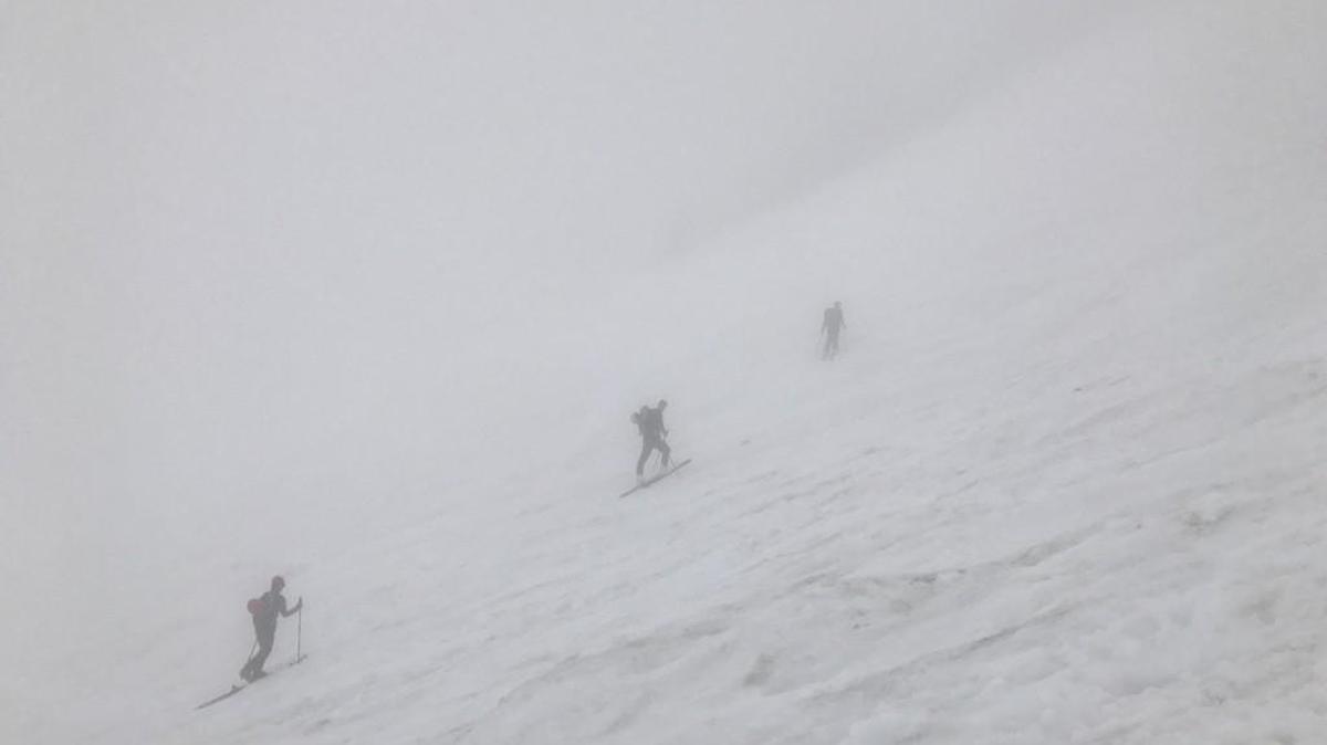 Skiers make their way upward toward Camp Muir on an overcast day in early June. A skier went missing on July 3 after falling through a snowbridge and into Pebble Creek while attempting to ski from Camp Muir to Paradise.
