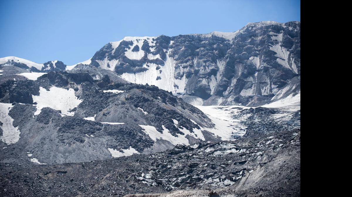A view of Mount St. Helens from the crater rim is seen in June during an uphill hike. The crater is home to a glacier that is the world’s youngest, formed after the mountain blew in 1980