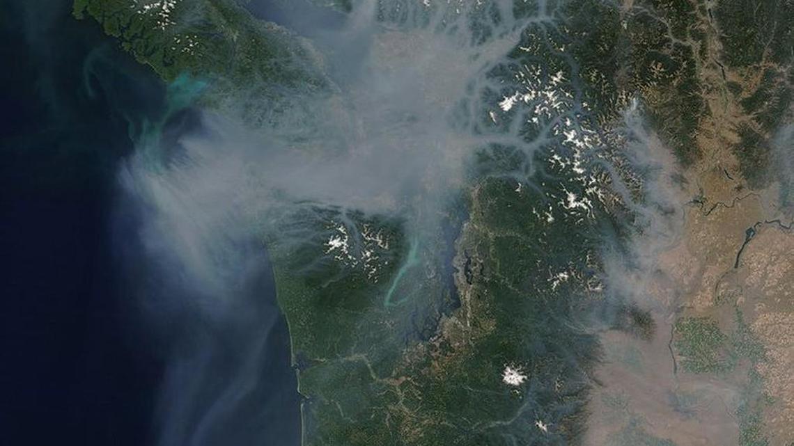 A NASA Terra satellite image shows smoke from the 2017 wildfires in British Columbia descending south over the Puget Sound.