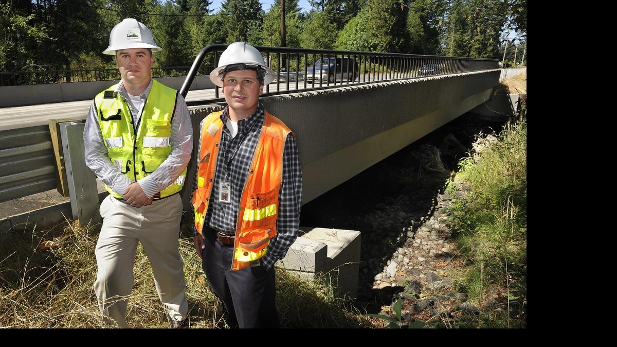 
Engineers Matt Unzelman, right, and Brandon Hicks from Thurston County Public Works were recently honored as the Project Managers of the Year for the Washington State Association of County Engineers (WSACE) for their work on the Salmon Creek bridge replacement project in 2014. This is the first time the award has been given to two individuals. 
