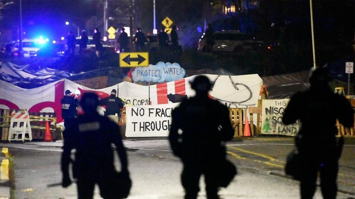 Representatives from the Olympia police, Thurston County Sheriff’s, railroad police and Washington State Patrol moving in to clear anti-fracking protesters blocking the rail line at 7th and Jefferson in downtown Olympia around early Wednesday morning.