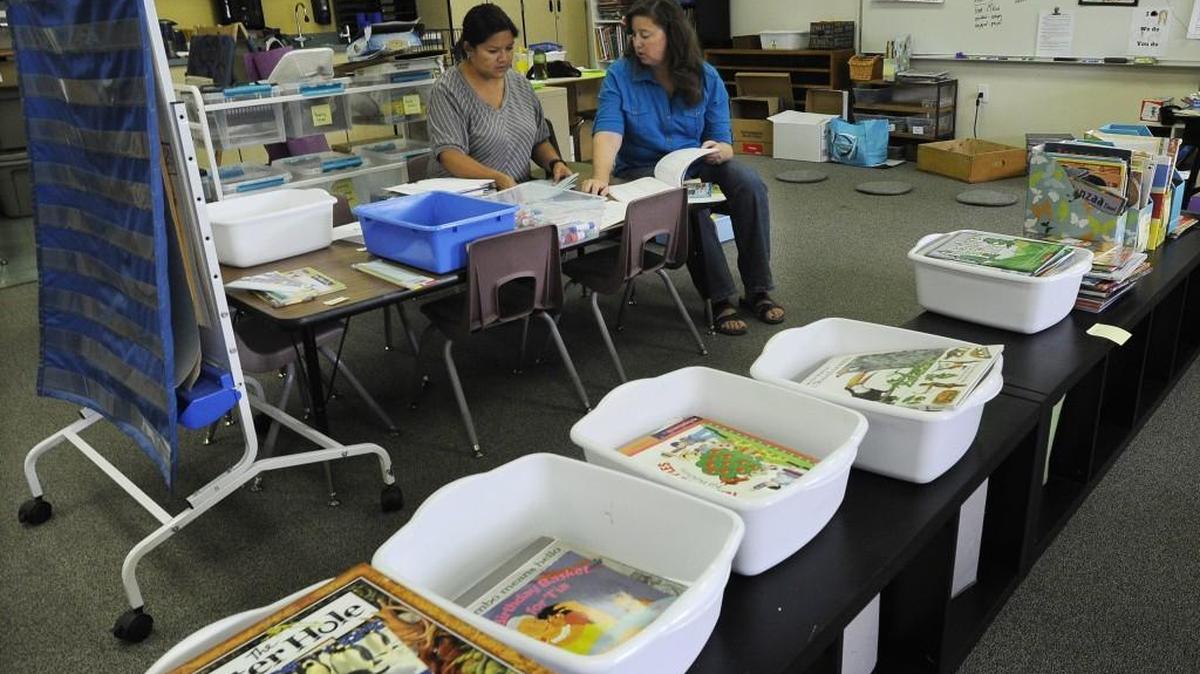 
Mountain View Elementary School kindergarten teacher Tina Ellis, right, and teaching assistant Lee Anne Velez get their teaching materials and supplies squared away in preparation for the new school year.
