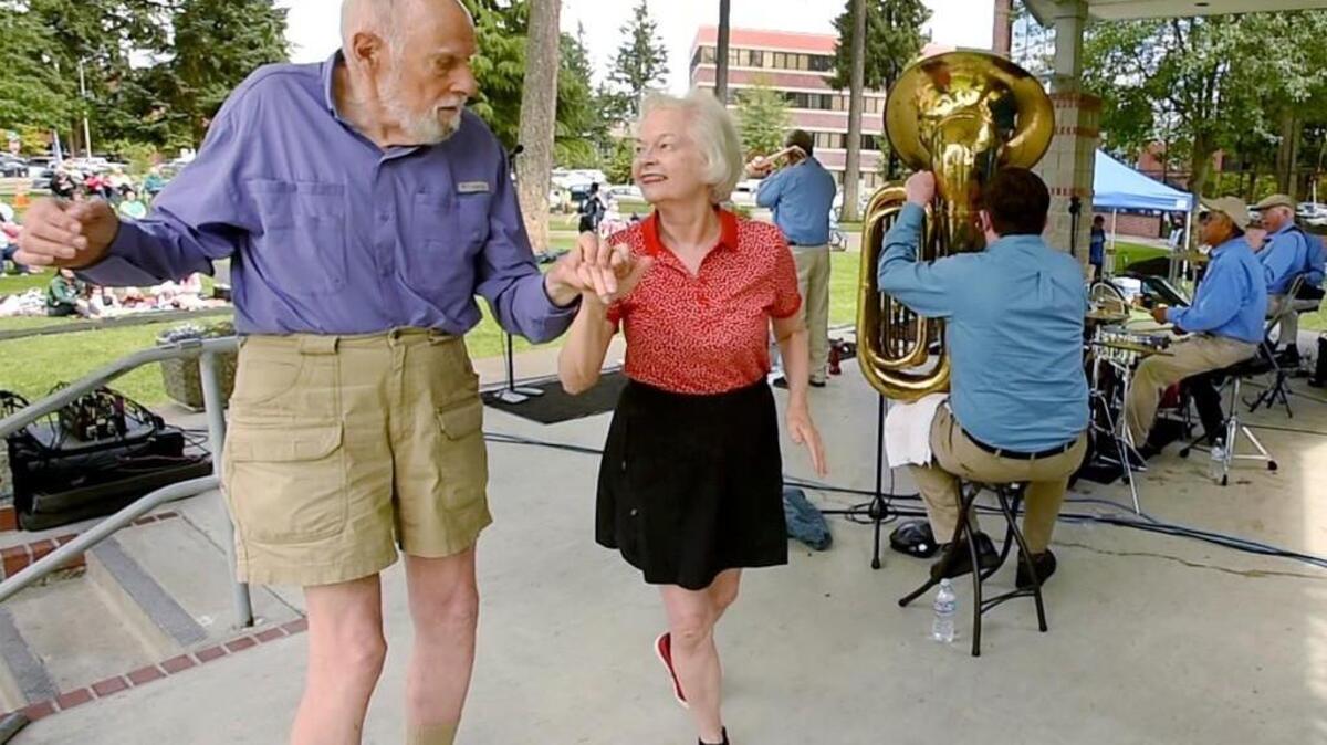 The High Sierra Jazz Band kicks-off the Lacey In Tune summer noon concert series Wednesday at Huntamer Park while offering a taste of the 27th  Annual America’s Classic Jazz Festival which starts Thursday at Saint Martin’s University. Joining them on stage were David and Suzanne Joseph from Falls Church, VA, who’ve enjoyed dancing at the festival for over a decade. Running though Sunday June 25th with performances at several venues the festival opens Thursday evening with a 7 P.M. jazz concert and dance at the Worthington Center on the SMU campus. Further festival information can be found at www.olyjazz.com.