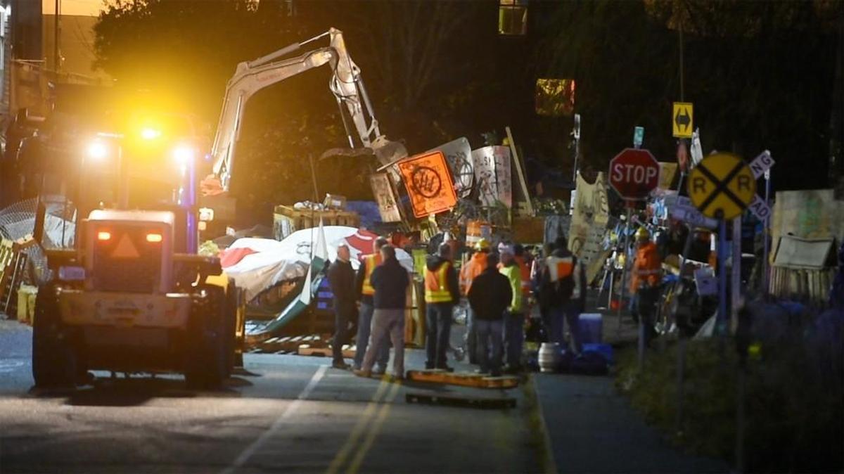Crews worked to clear the railroad tracks on Wednesday, Nov. 29, 2017 after police removed protesters.