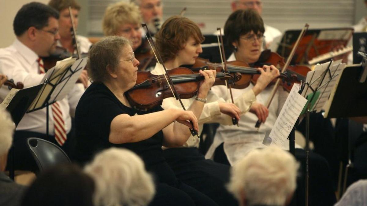 Members of the South Puget Sound Community Orchestra play a free concert to more than 100 people at the Lacey Community Center in December 2008.