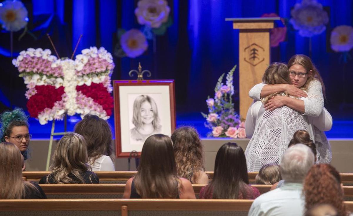 Family members gather before the memorial service for Lindsey Baum at Evergreen Christian church in Olympia on Aug. 18, 2018. Baum's remains were found by hunters in eastern Washington in fall 2017, and law enforcement announced that her identity had been confirmed in May 2018.