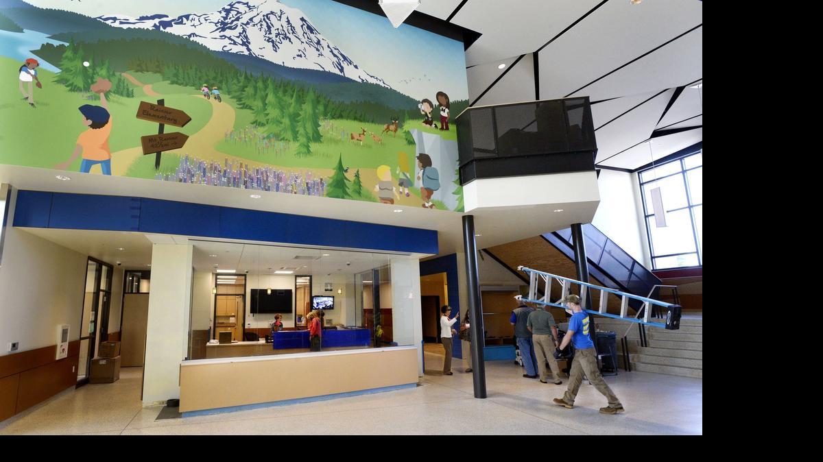 
High ceilings, natural light and a huge mural of children playing on Mount Rainier make for a welcoming lobby at the new Rainier Elementary School, which opened at JBLM last fall. The next school at the base that’s in line for federal funding is Evergreen Elementary.
