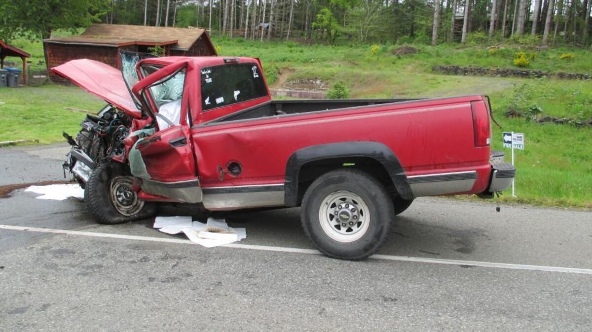 One of three vehicles damaged in a fatal Monday morning crash sits beside state Route 3 north of Shelton.