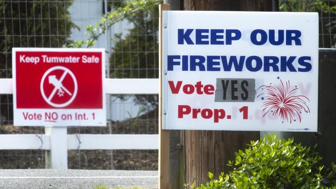 Campaign signs for and against the ban on fireworks in Tumwater.
