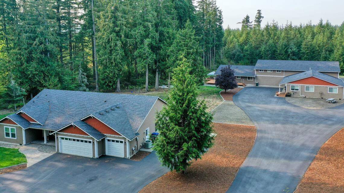 A property listed for sale in September 2025 in Olympia has three homes, plus a shop and office.