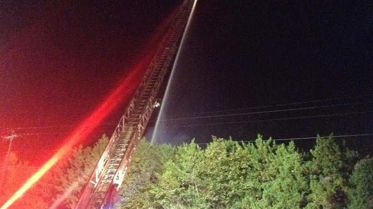 
Olympia Fire Crews spray water onto Bailey’s Motor Inn Thursday night after the east side of the former hotel and lounge caught fire about 9 p.m.
