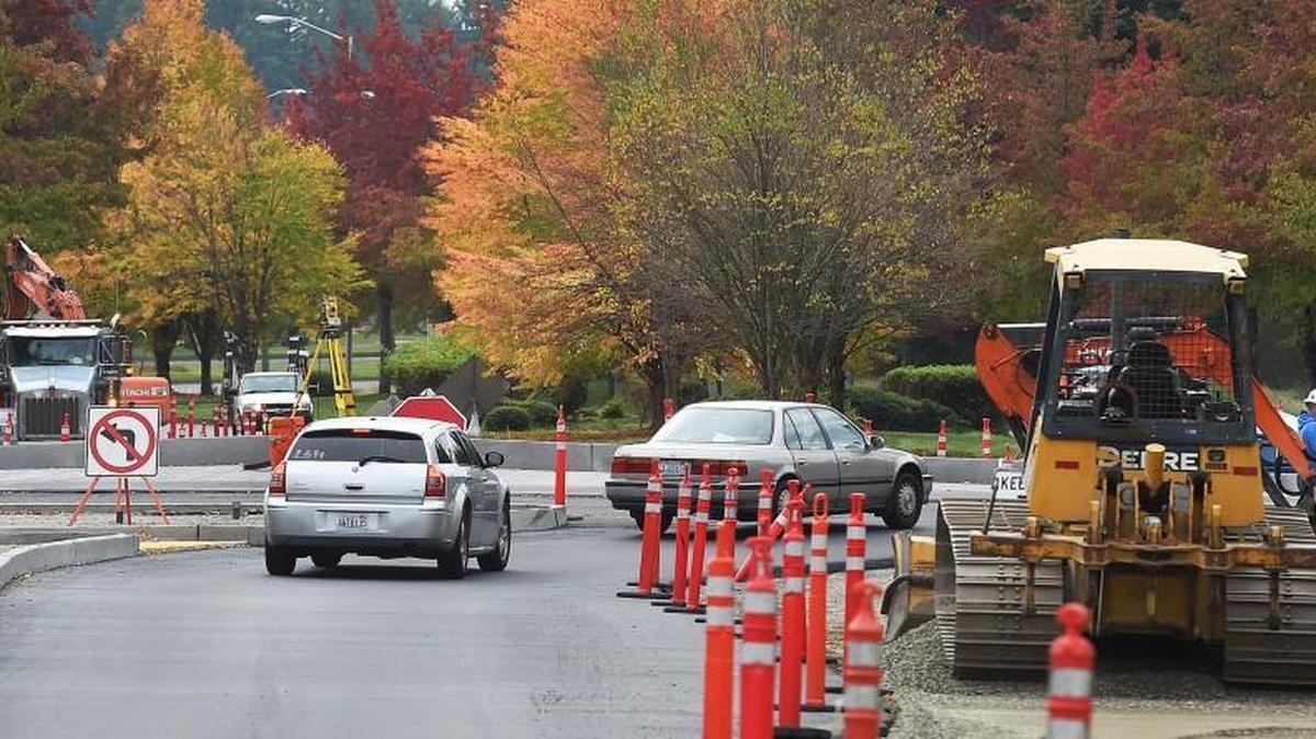 Motorists make their way around the new roundabout at Willamette Drive & 31st Avenue in Hawks Prairie. The intersection will be closed Oct. 27 and Oct. 29 so that crews can complete some paving and road striping.