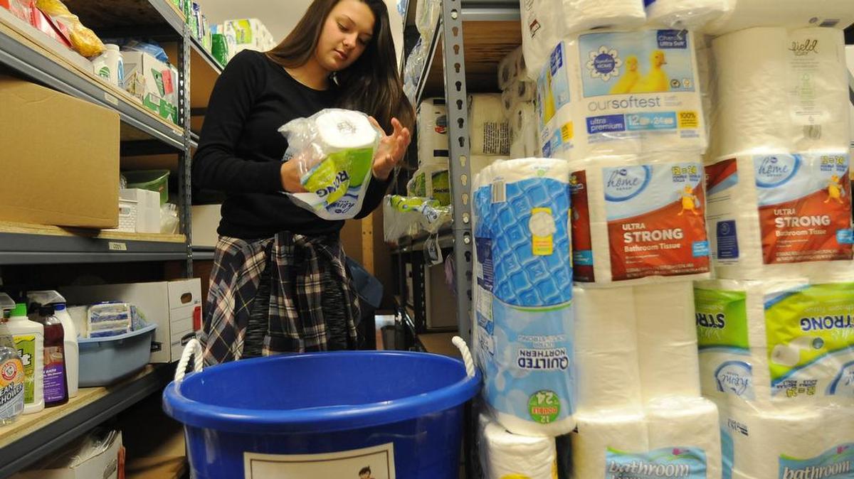 Just a week into the YWCA of Olympia’s Economic Empowerment Program 16-year-old Hailey Sproule works on the client inventory supplies at the organization’s Other Bank facility Monday. The group received grant assistance from the United Way organization.
