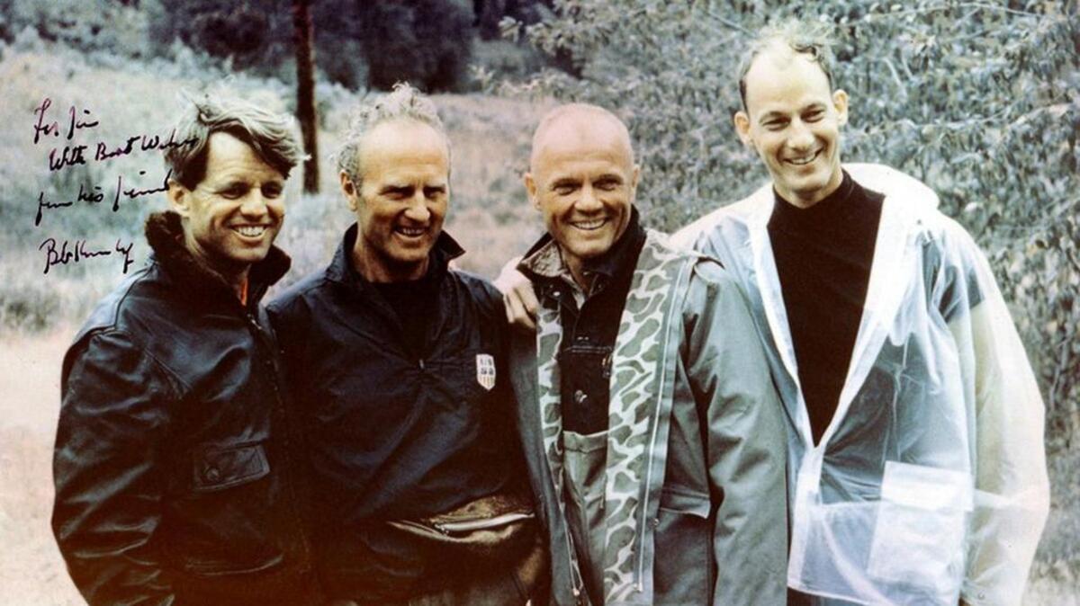 Jim Whittaker and John Glenn, who knew each other in the 1960s as part of Bobby Kennedy’s circle of friends, are seen on a 1967 river trip. From left were Kennedy, ski coach Willy Schaeffler, Glenn and Whittaker.