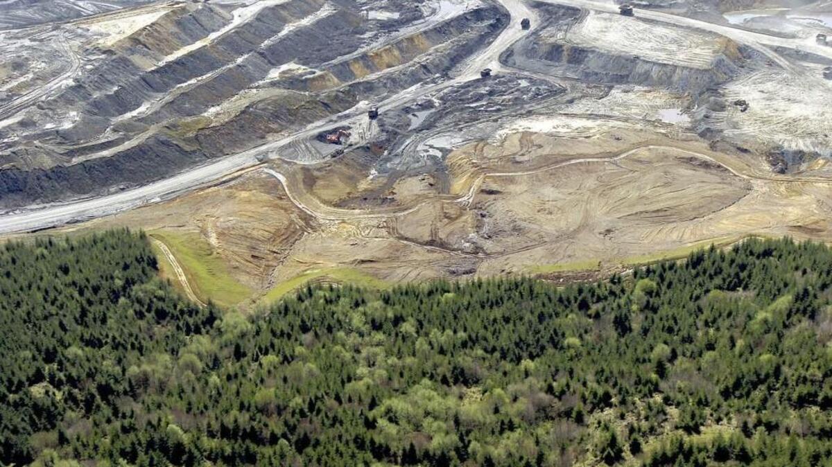 An active open pit coal mine at TransAlta is seen in this 2004 file photo. The area has been replanted and returned to pasture in the years since the mine closed, and now TransAlta intends to turn the area into a massive solar energy project that when complete would be the largest in the state.