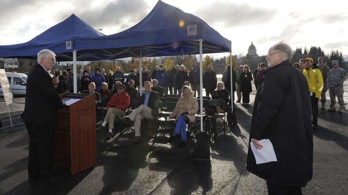 After opening remarks by Olympia Mayor Stephen Buxbaum, right, Jerry Reilly of the Olympia Capital Park Foundation thanks voters and supporters during a Thursday morning celebration at the site of the recently demolished and long-vacant former Thurston County Health Department building across from Heritage Park and Capitol Lake.