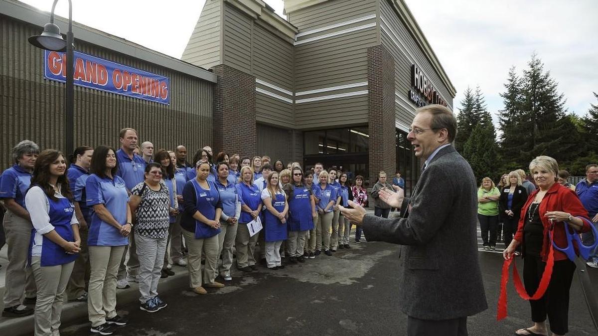 
Olympia Hobby Lobby store manager Mike Trudnak welcomes his employees along with around 100 customers before the grand opening Sept. 7.
