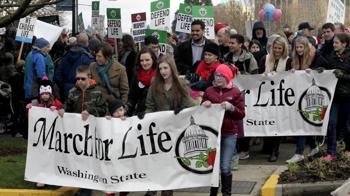 After gathering at the Winged Victory monument, abortion protesters congregate on the steps of the Legislative Building for the annual March for Life rally.
