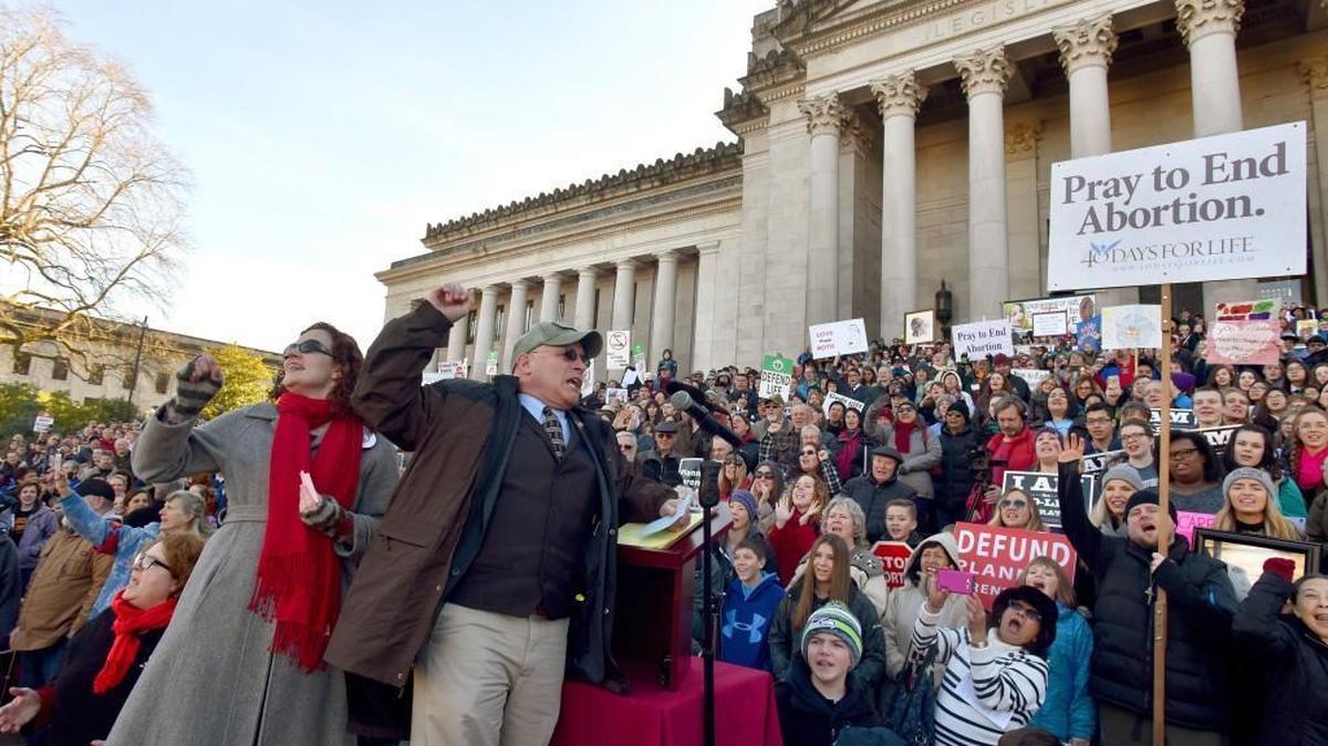 March for Life President Noreen McEntee Hobson and Rep. Brad Klippert address the crowd at the March for Life rally in Olympia in 2017.
