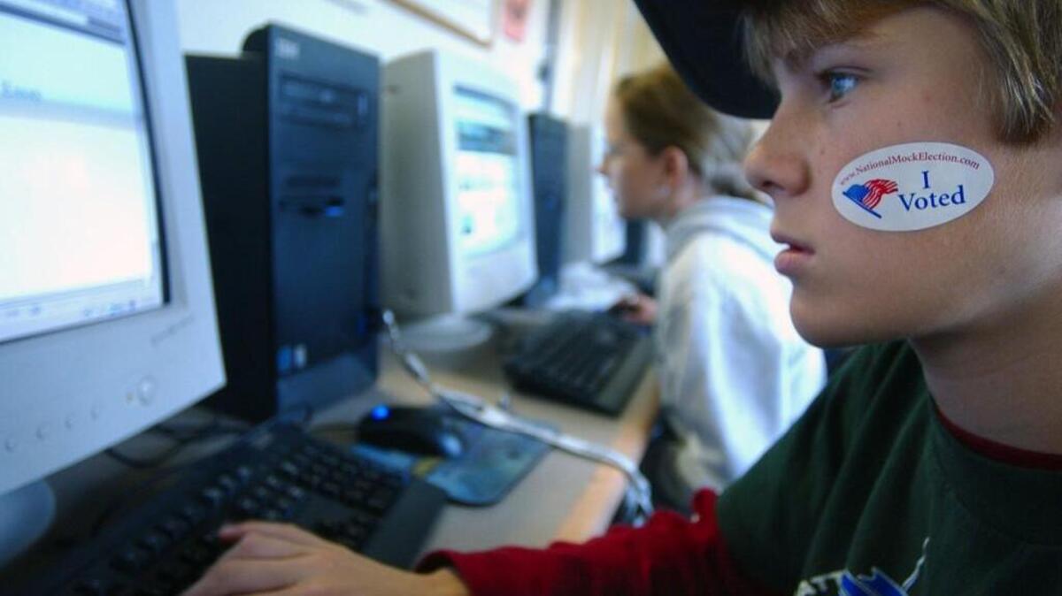 Twelve-year-old Drew Lyons, a seventh-grader at NOVA School in Olympia, wears an “I Voted” sticker after participating in the 2008 Mock Election.