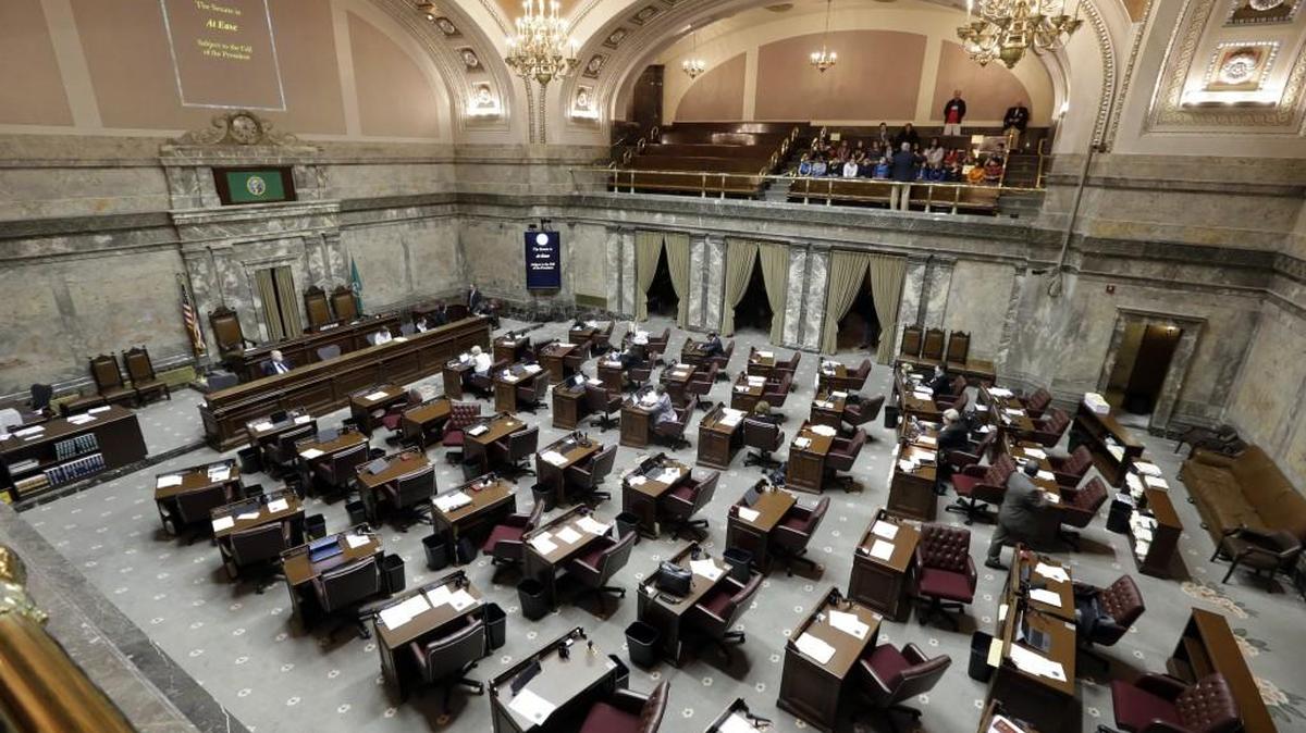 As a group of students from Arthur Jacobsen elementary school look on from the gallery, the Senate floor below stands empty after a break shortly after the opening during the first day of a 30-day special session of the Legislature Wednesday, April 29, 2015, in Olympia, Wash. Lawmakers returned to start the session to address things they couldn't resolve in the Legislature's 105-day regular session.