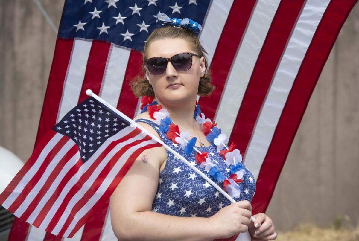 Nickole Wallace of Olympia waits with the New Beginnings Bible Fellowship float for the start of Tumwater's Fourth of July parade.