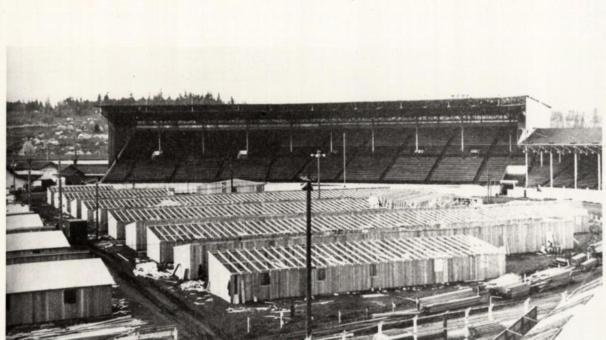 Camp Harmony dormitories were under construction in the infield of the Puyallup Fair grandstands in 1942. More than 7,300 persons of Japanese decent were imprisoned at Camp Harmony during WWII.