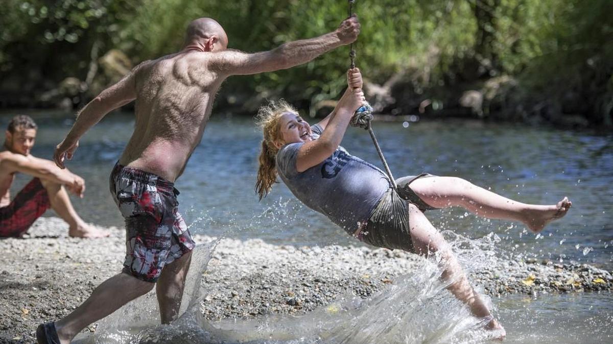 OLYMPIAN FILE PHOTO: Local residents enjoy the cool Deschutes River near Pioneer Park in Tumwater during a June summer day.