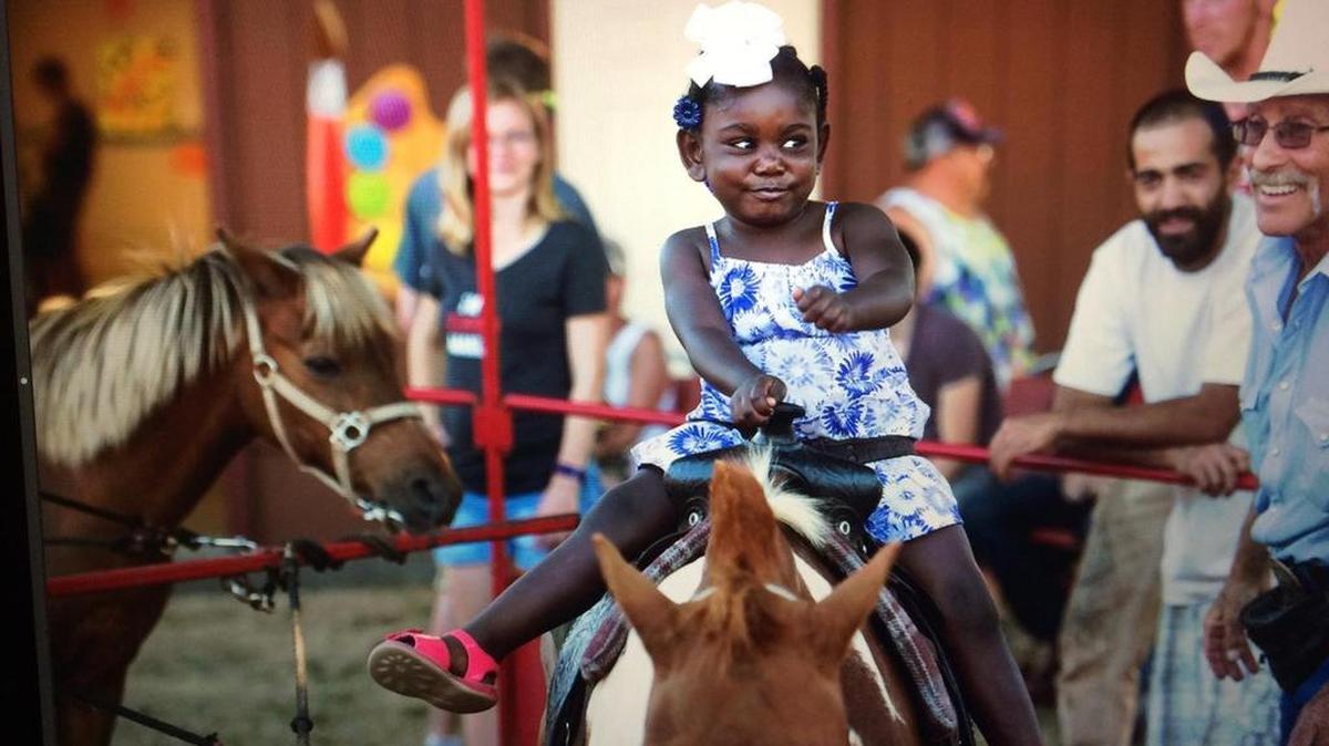 
Raquelle Carroll, 3, of Lacey, takes a ride on the ponies at the Thurston County Fair in Lacey on Wednesday, July 29, 2015. The fair's attendance was lower this year due to hot weather, officials say. 
