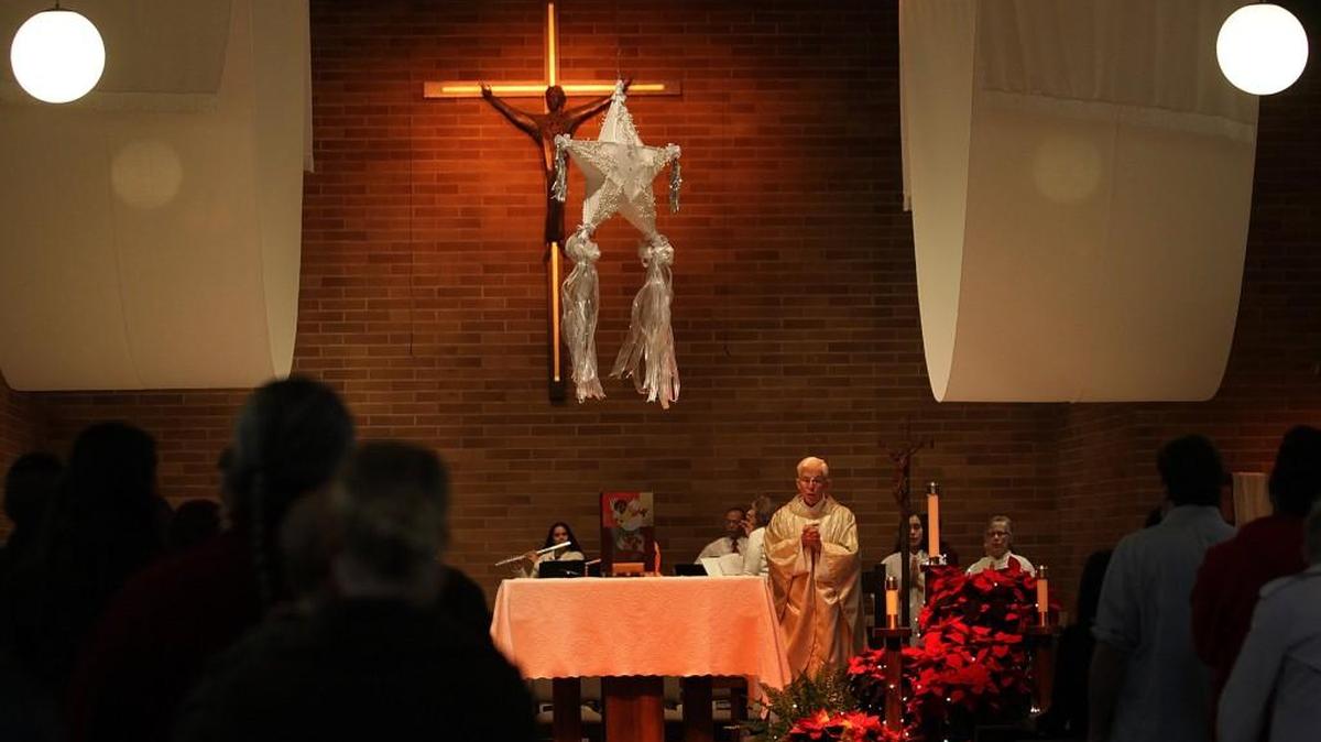 
The Rev. Patrick McDermott officiates a Christmas Day Mass in 2013 to a near-capacity congregation at the Sacred Heart Catholic Church in Lacey.
