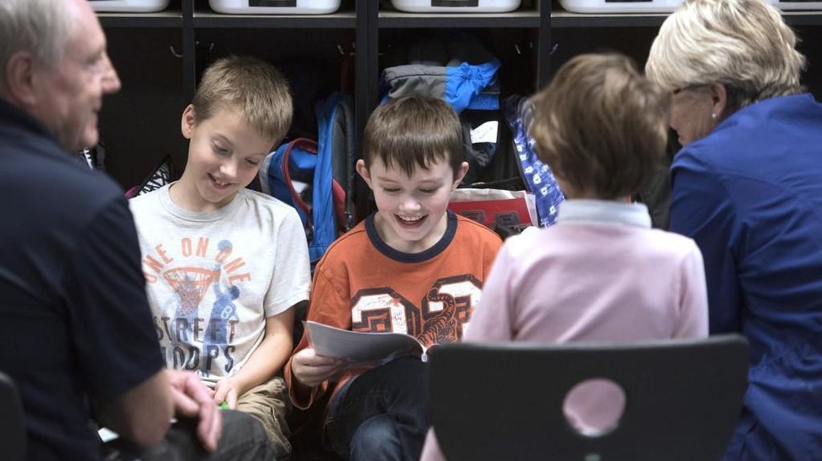 Aaron Blume, left, and Kyle Stucki read their stories to visiting parents and classmates in Erin Vroman’s third-grade classroom at Woodland Elementary School in Lacey on Friday.